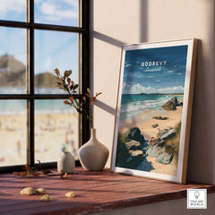 Godrevy Beach Poster - North Cornwall Coast Wall Decor displayed on a table by the window with serene beach view.