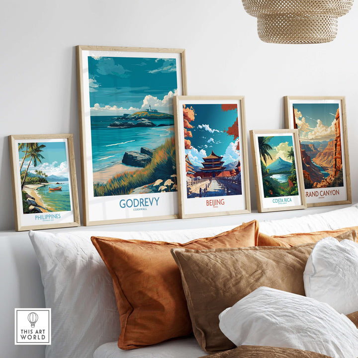 Collection of travel posters including Godrevy, showcasing stunning landscapes and beach views in a stylish living space.