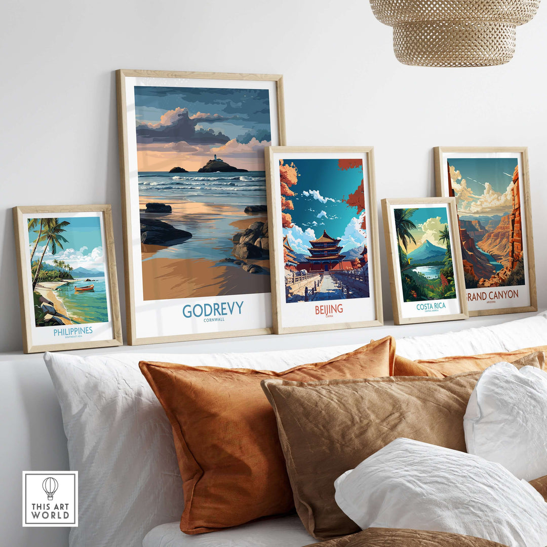 Framed travel posters featuring Godrevy, Philippines, Beijing, Costa Rica, and Grand Canyon on a stylish wall.