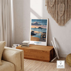 Godrevy Poster - Lighthouse Sunset - Cornwall Travel Print - Coastal Art - Beach Wall Decor displayed in a cozy living room.