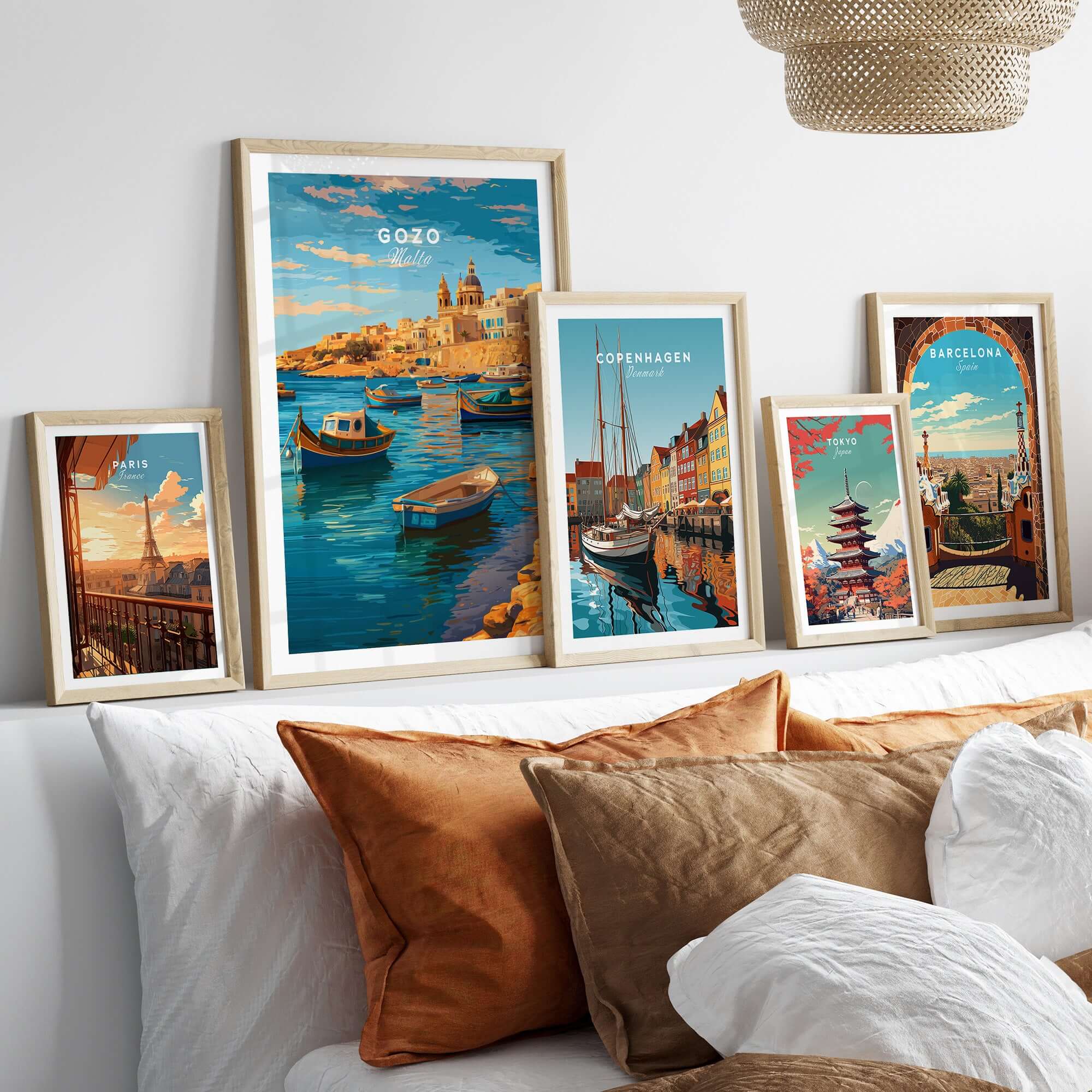 Gozo Poster - Mediterranean Print | Maltese Island Wall Decor displayed among other city prints on a cozy sofa.