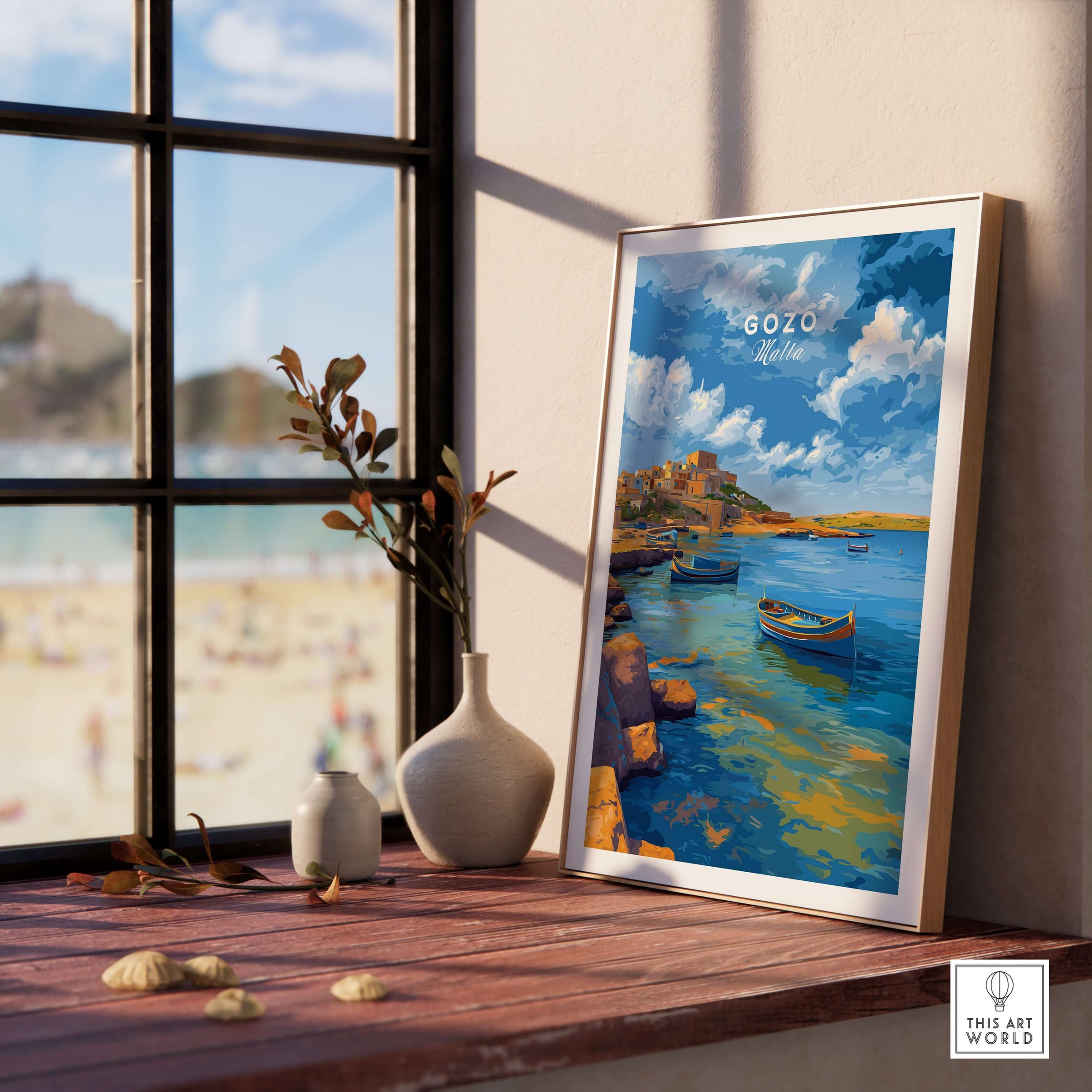 Gozo Xlendi Bay Beach Scene Print | Mediterranean Home Decor displayed in a sunlit room near a window.