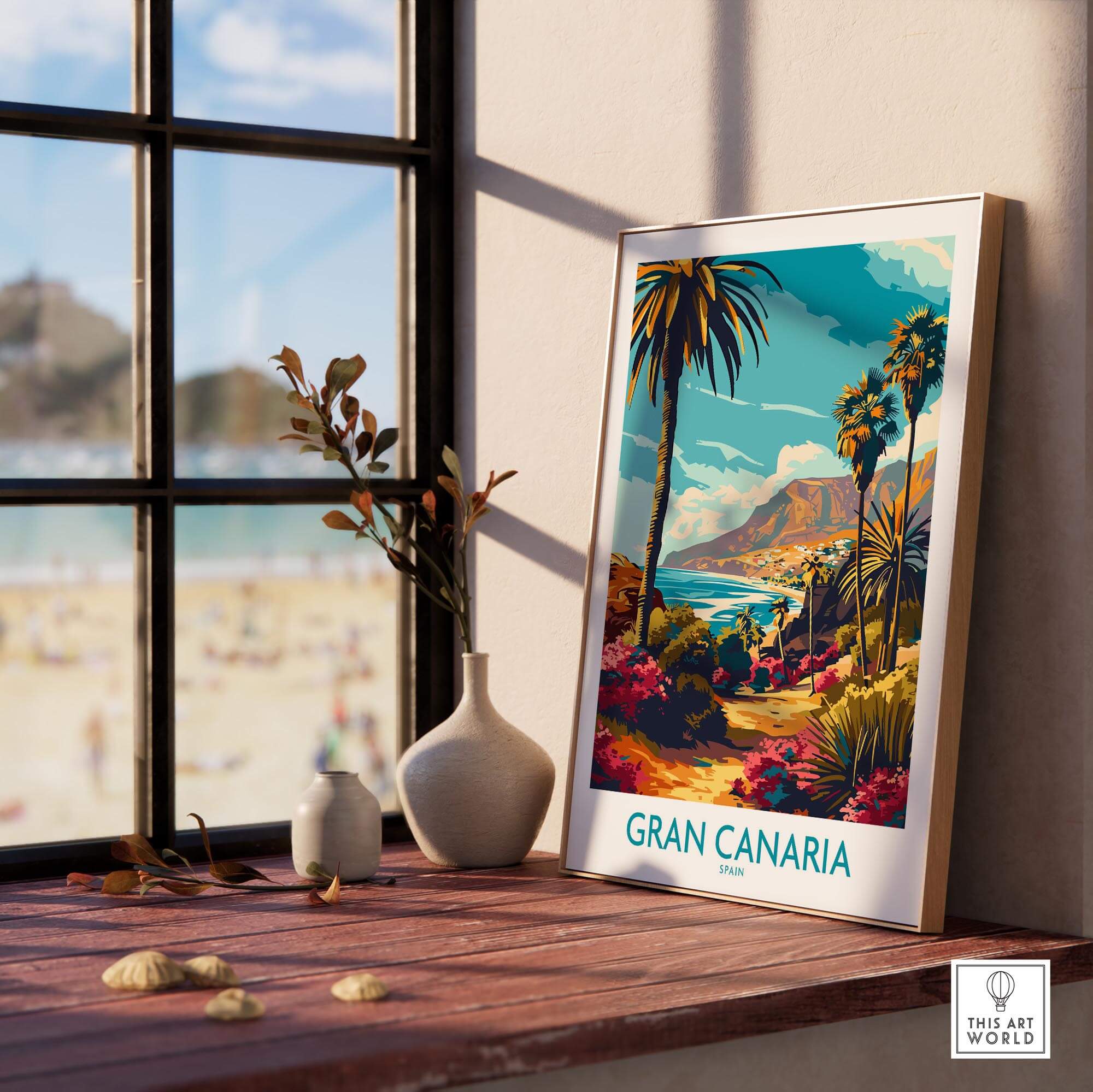 Gran Canaria Poster - Canary Islands displayed on a wooden table near a window with beach view.