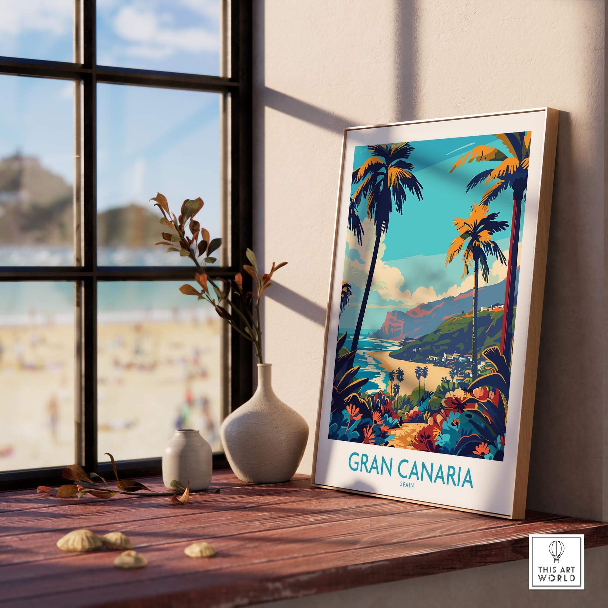 Gran Canaria Travel Poster - Canary Islands displayed on a table near a window with beach view.