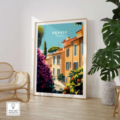 Grasse France Wall Art displayed in a stylish home interior, featuring colorful houses and lush plants.