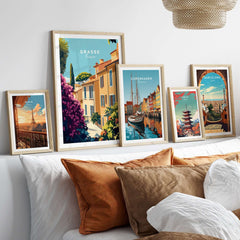 Grasse France Wall Art collection displayed on a stylish bed, showcasing vibrant European landscapes.