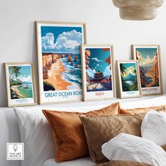 Great Ocean Road Travel Poster displayed among other travel art on a cozy couch setting, inspiring wanderlust.