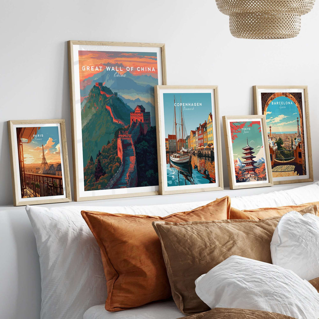 Great Wall of China Ridge Walk poster and other travel art prints displayed on a cozy bed with decorative pillows.