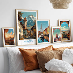 Gruyères Switzerland Poster | Scenic Alpine Village Canvas Print displayed among framed artworks on a stylish couch.