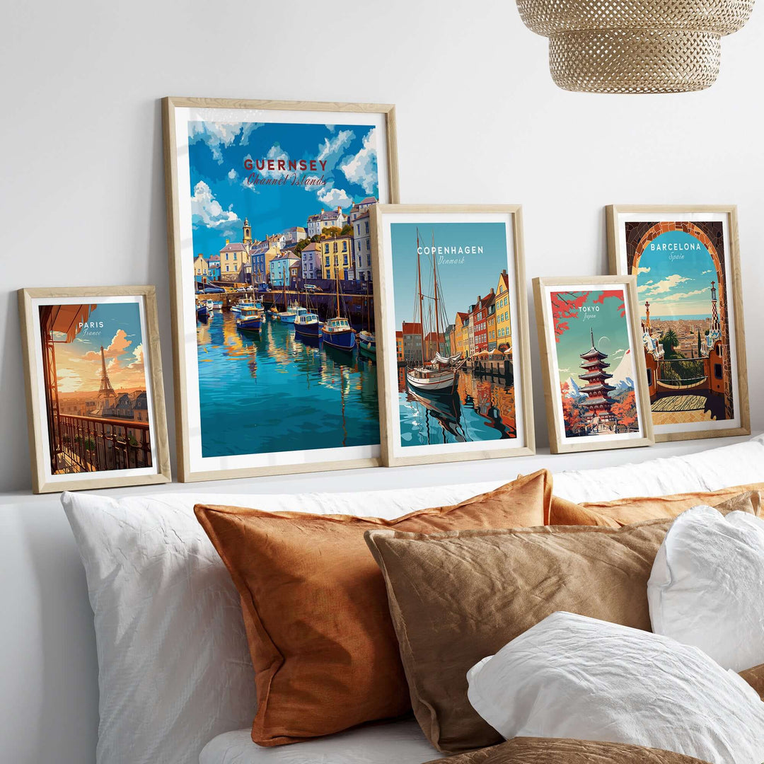 Guernsey Colourful Seaside Village Print | Channel Islands Wall Decor showcased among other vibrant city prints on a stylish sofa.