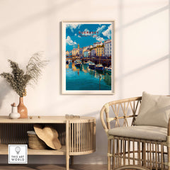 Guernsey Colourful Seaside Village Print | Channel Islands Wall Decor displayed in a stylish home interior with rattan furniture.