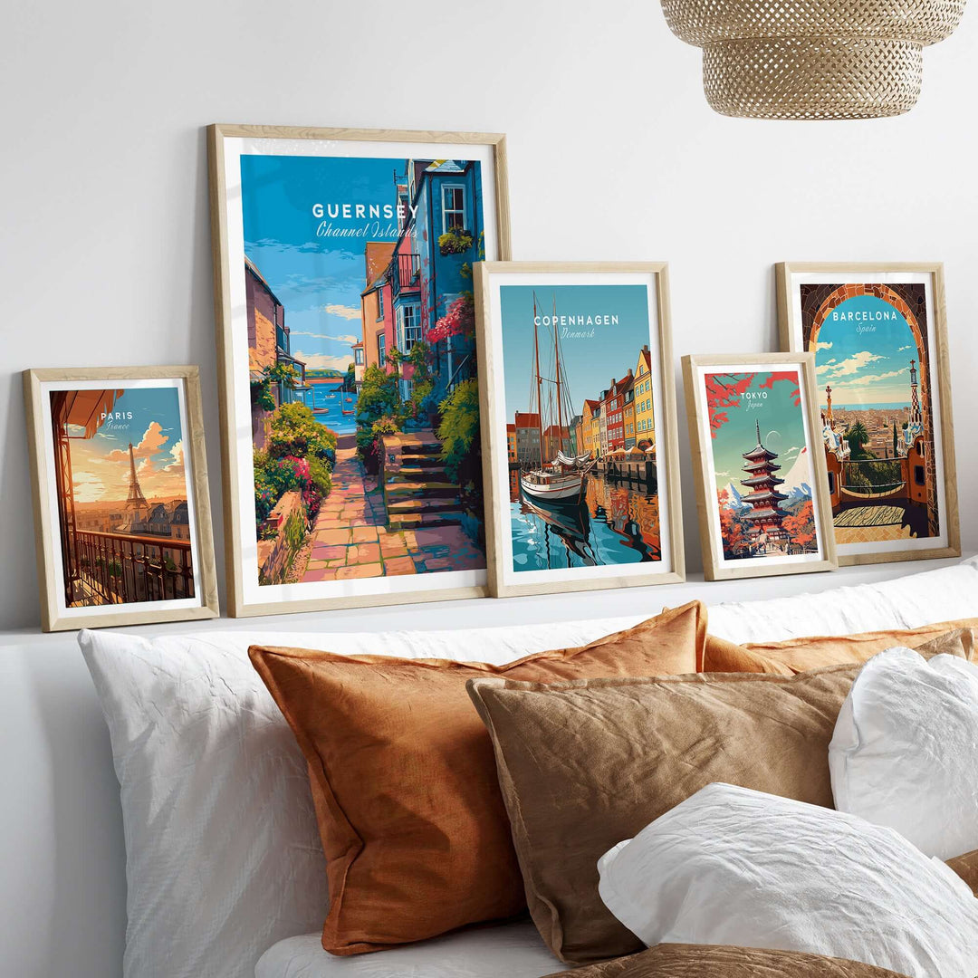 Guernsey St Peter Port Steps Print | British Seaside Wall Decor displayed with other framed travel art on a cozy sofa.