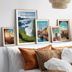 Gullfoss Falls Poster Iceland | Nordic Nature Wall Decor displayed with other travel posters on a modern couch.