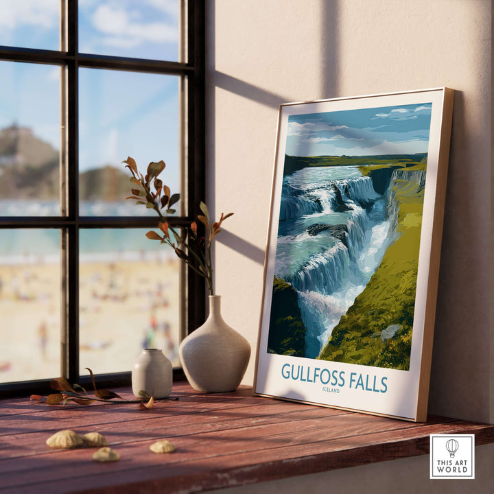 Gullfoss Falls Poster Iceland Print | Waterfall Poster displayed on a sunny windowsill with a beach view.
