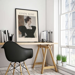Gustav Klimt Art Print - Portrait of a Lady in Black 1894 displayed in a modern office setting with a stylish chair.