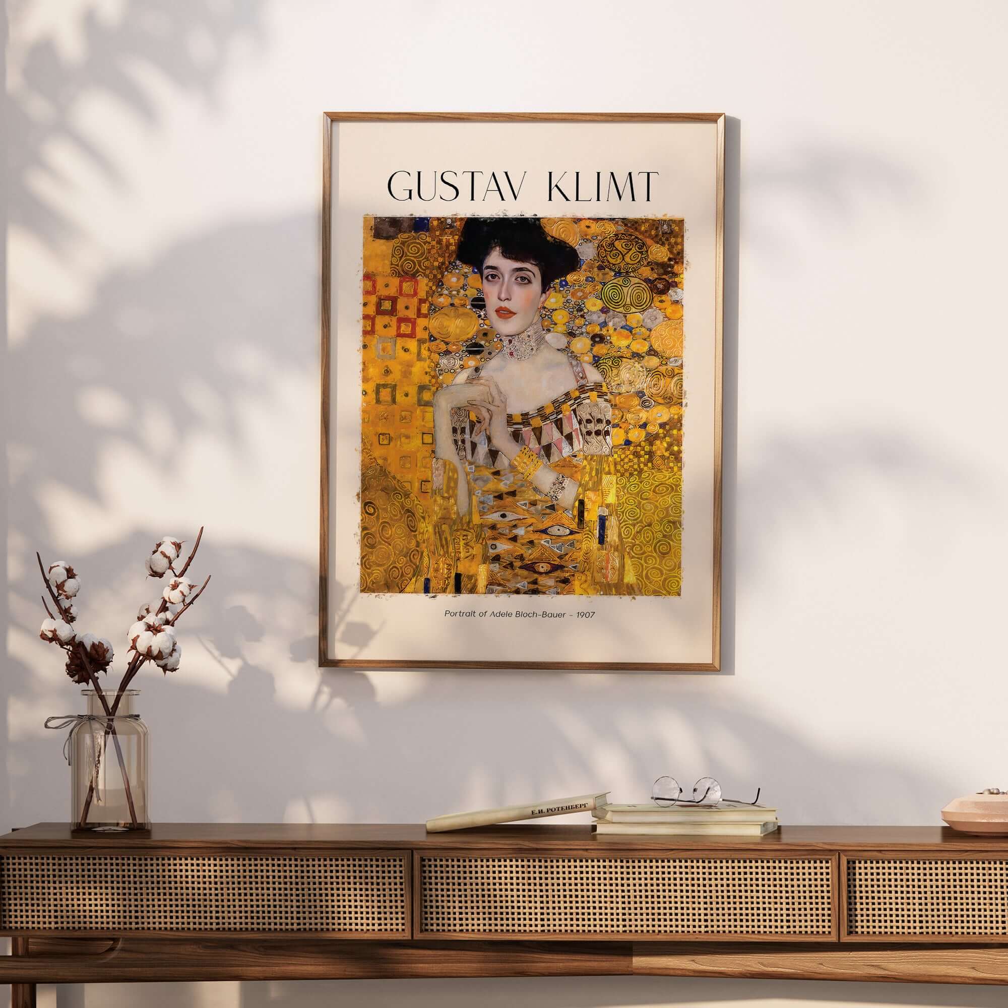 Gustav Klimt Art Print - Portrait of Adele Bloch-Bauer I Poster 1907 framed on a wall above a stylish wooden table.