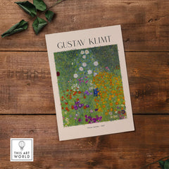 Gustav Klimt Art Print - Flower Garden Poster 1907 displayed on a wooden surface with green leaves.