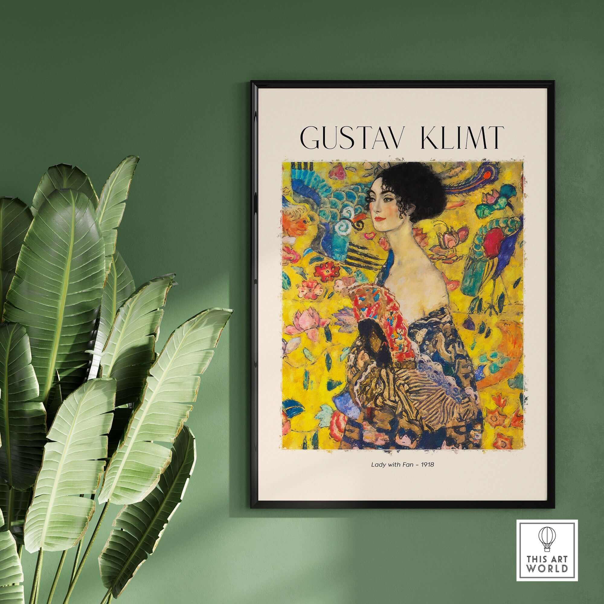 Gustav Klimt Lady with Fan Art Print 1918 - Art Nouveau Poster displayed on a wall with green backdrop and plants.