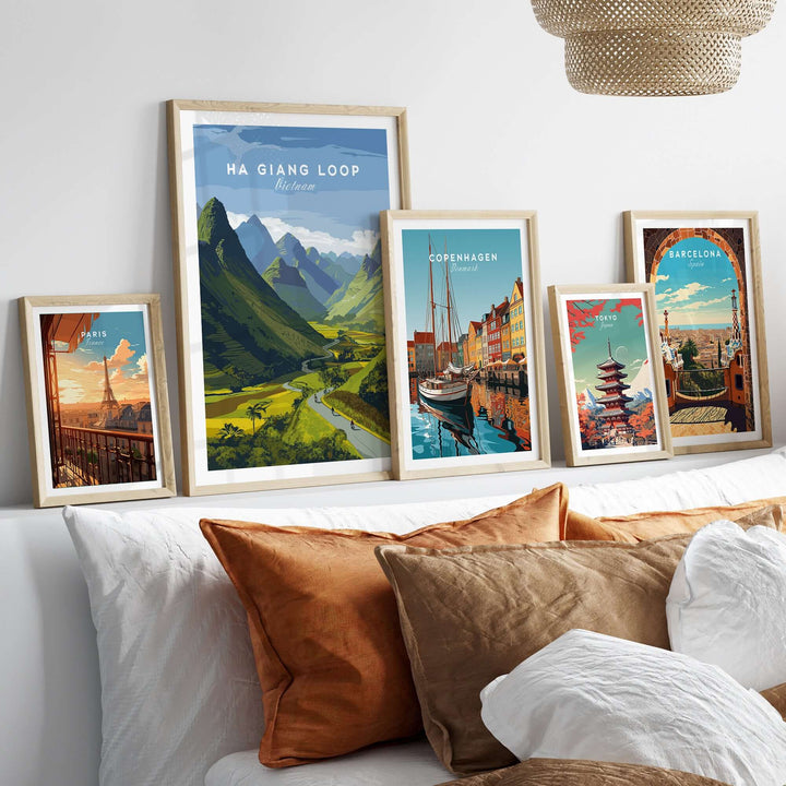 Ha Giang Loop Vietnam travel print poster collection on a cozy sofa, showcasing lush landscapes and cityscapes.