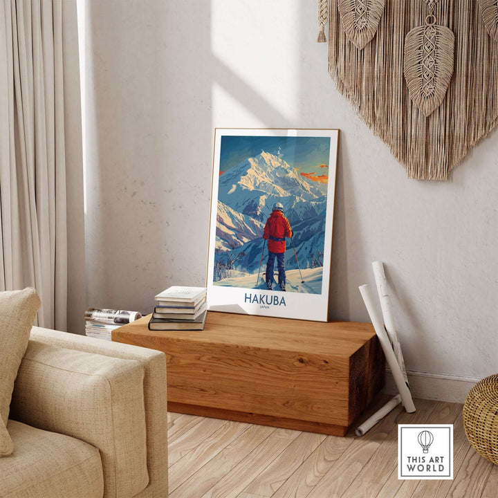 Hakuba wall art print featuring a skier overlooking snowy Japanese mountains, displayed in a cozy living room setting.