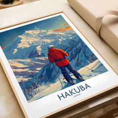 Skiing scene in Hakuba, Japan, wall art print featuring a skier in a red jacket against a snowy mountain backdrop, framed on a table.