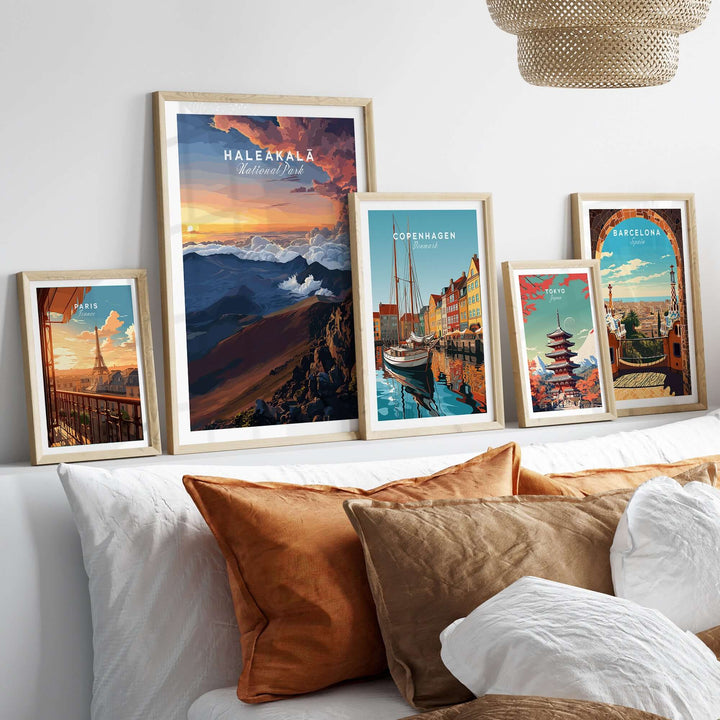 Haleakalā Sunset Poster and city travel prints showcased in a cozy living room setting.