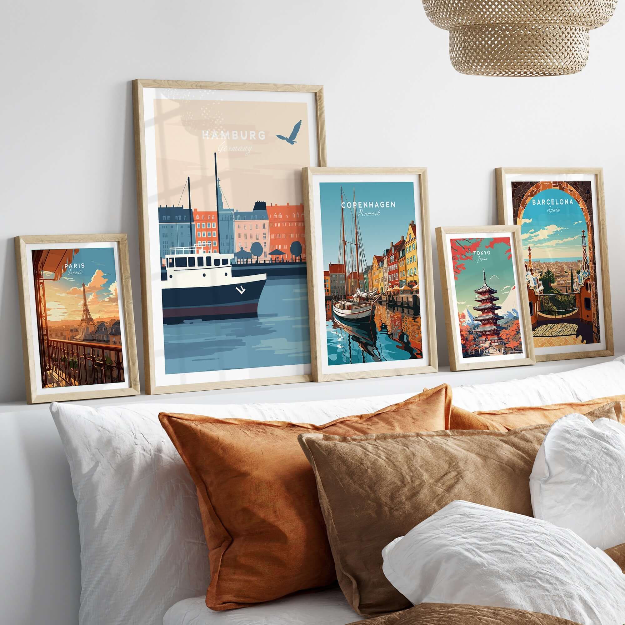 Hamburg Wall Art featuring beautiful city depictions in stylish frames on a cozy bed setting.