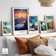 Hanover Travel Poster displayed among other travel posters, showcasing a vibrant sunset and urban skyline.