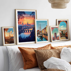 Hanover Travel Print showcased among other city travel prints on a cozy wall display, featuring vibrant sunset colors.
