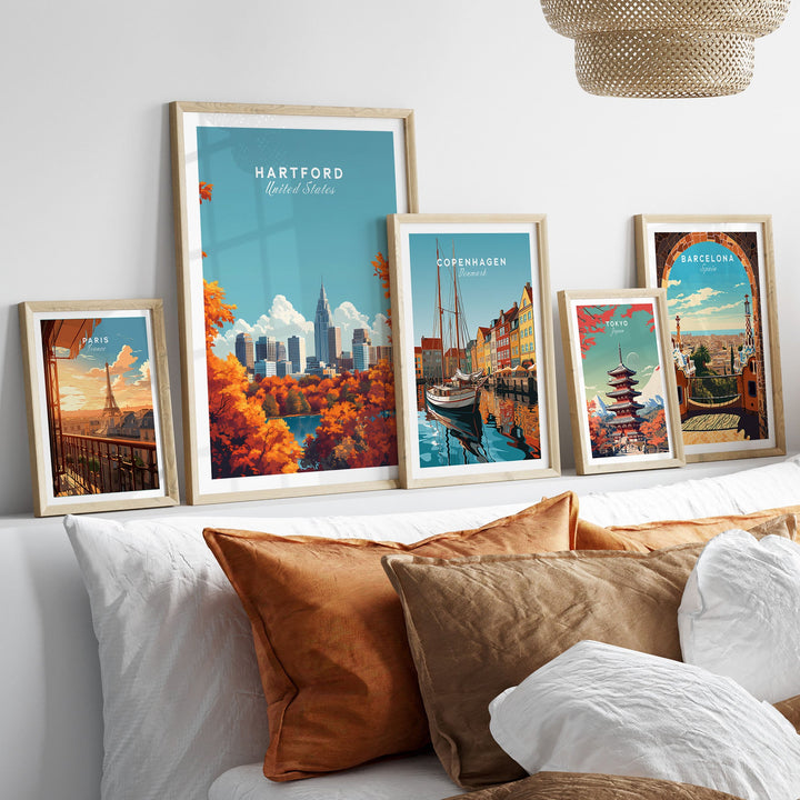 Hartford skyline wall art displayed among travel posters on a stylish bedroom wall.