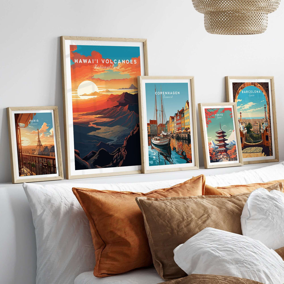 Hawaiʻi Volcanoes sunset poster and travel art prints displayed on a stylish bed with decorative pillows.