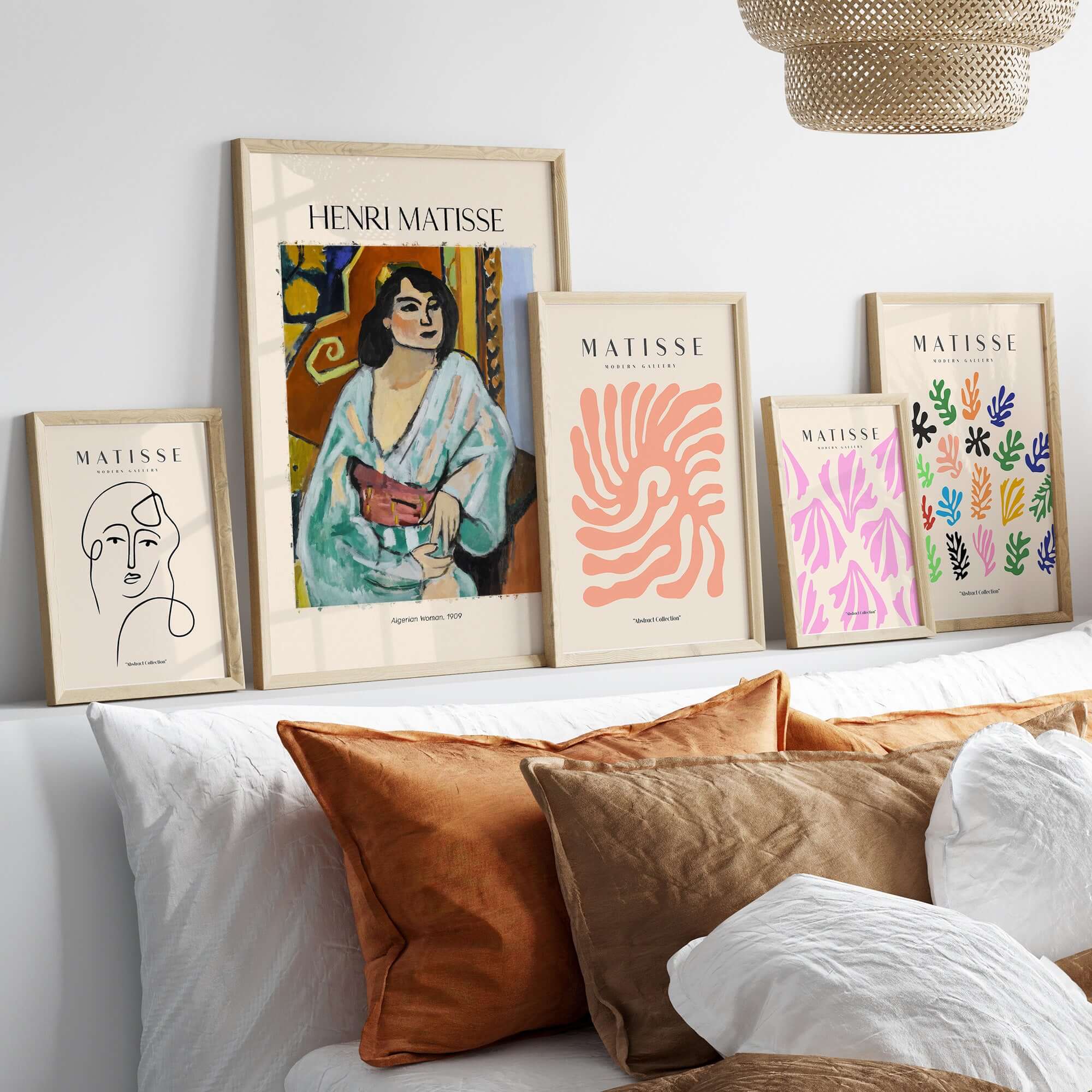 Matisse Poster - Algerian Woman 1909 Fauvist Wall Art Print displayed among various framed artworks on a stylish wall.