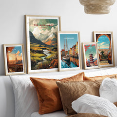 The Highlands Scotland Autumn Valley | Scottish Travel Wall Decor displayed with other travel prints in a cozy interior setting.