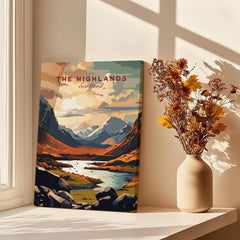 The Highlands Scotland Mountain River Art Print | Glencoe Landscape Poster displayed next to flowers in a vase.