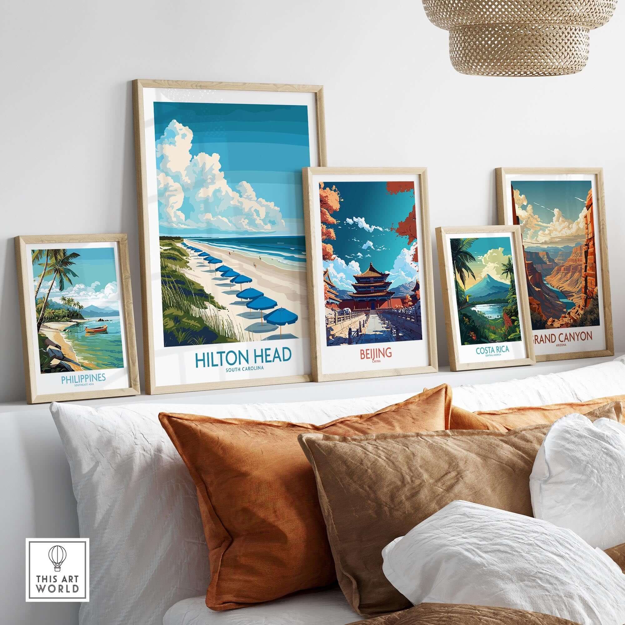 Hilton Head Travel Poster and other travel posters displayed on a wall above a couch, showcasing coastal and scenic views.