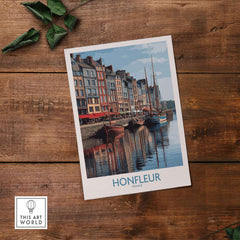Honfleur Poster - Normandy France Travel Print - Boats and Buildings Wall Art on wooden table with greenery.