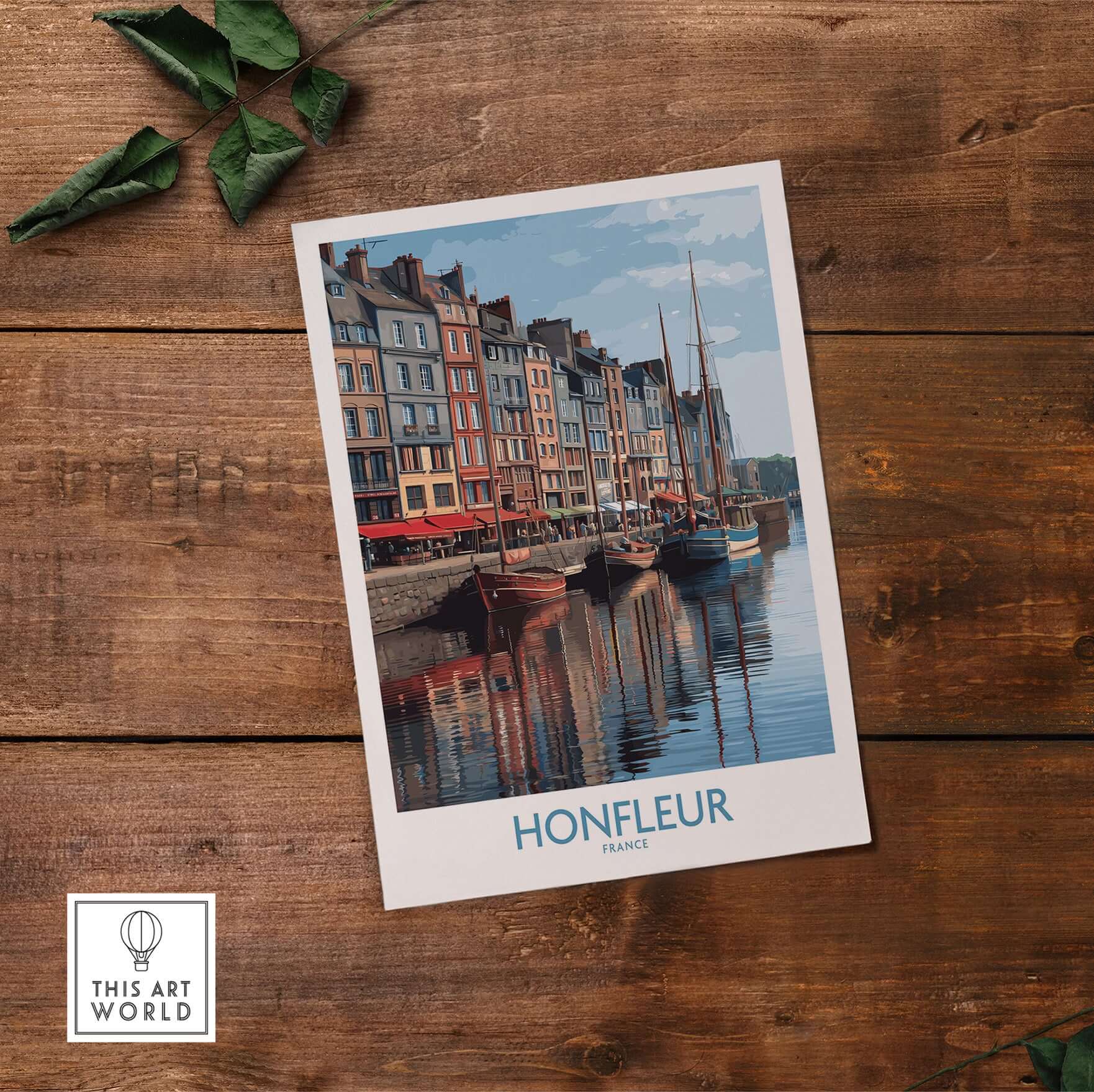 Honfleur Poster - Normandy France Travel Print - Boats and Buildings Wall Art on wooden table with greenery.