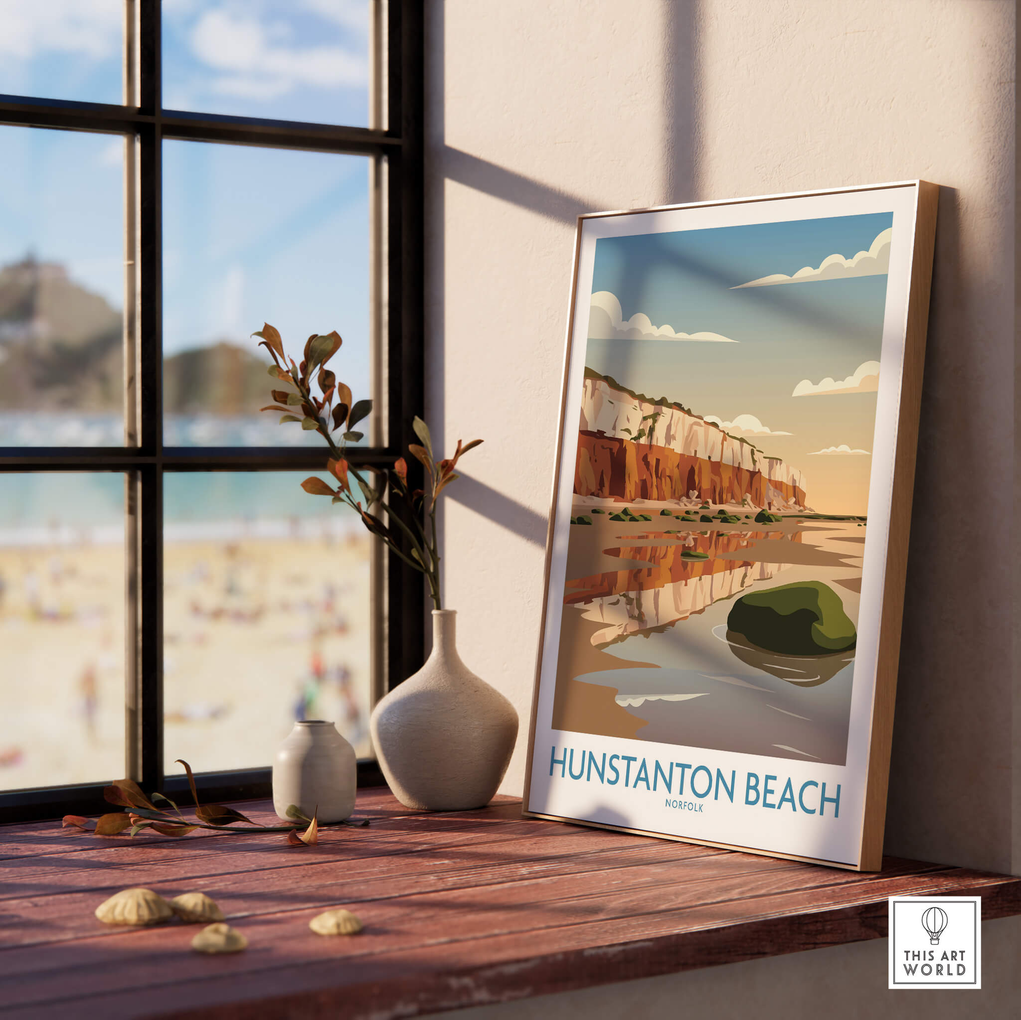Hunstanton Beach Norfolk Poster | British Seaside Landscape Canvas Print displayed on a wooden table with a view of the beach.
