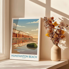 Hunstanton Beach Norfolk Poster | British Seaside Landscape Canvas Print displayed in a bright room with flowers.