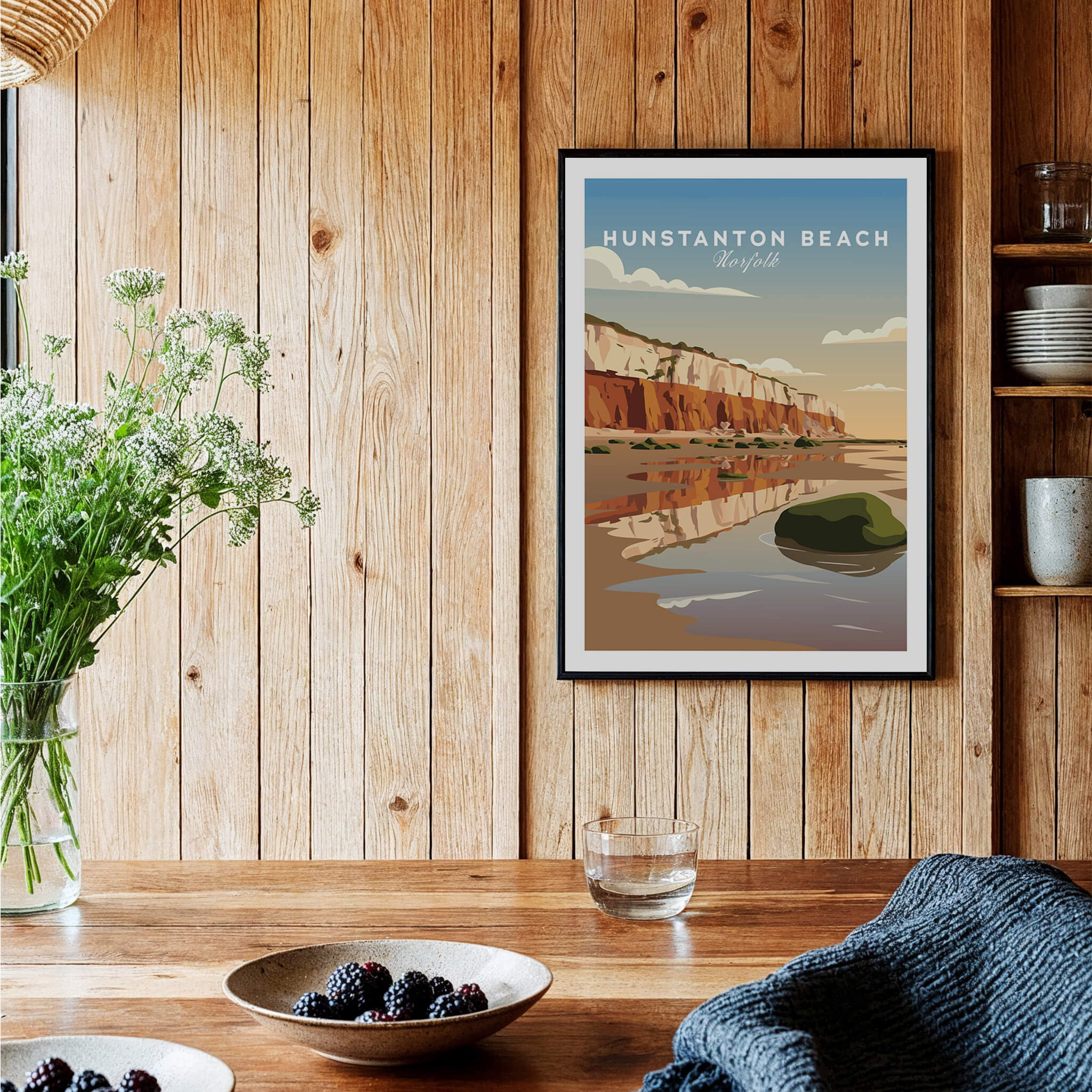 Hunstanton Beach Norfolk Wall Art Print | Red Cliffs Coastal Travel Poster displayed in a cozy wooden interior.