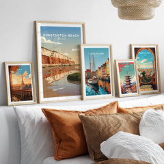Hunstanton Beach Norfolk Wall Art Print | Red Cliffs Coastal Travel Poster displayed among various framed travel art prints.