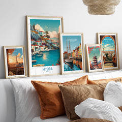 Hydra Greece Canvas Print | Blue Sea & White Architecture Poster displayed in stylish frames on a cozy sofa.