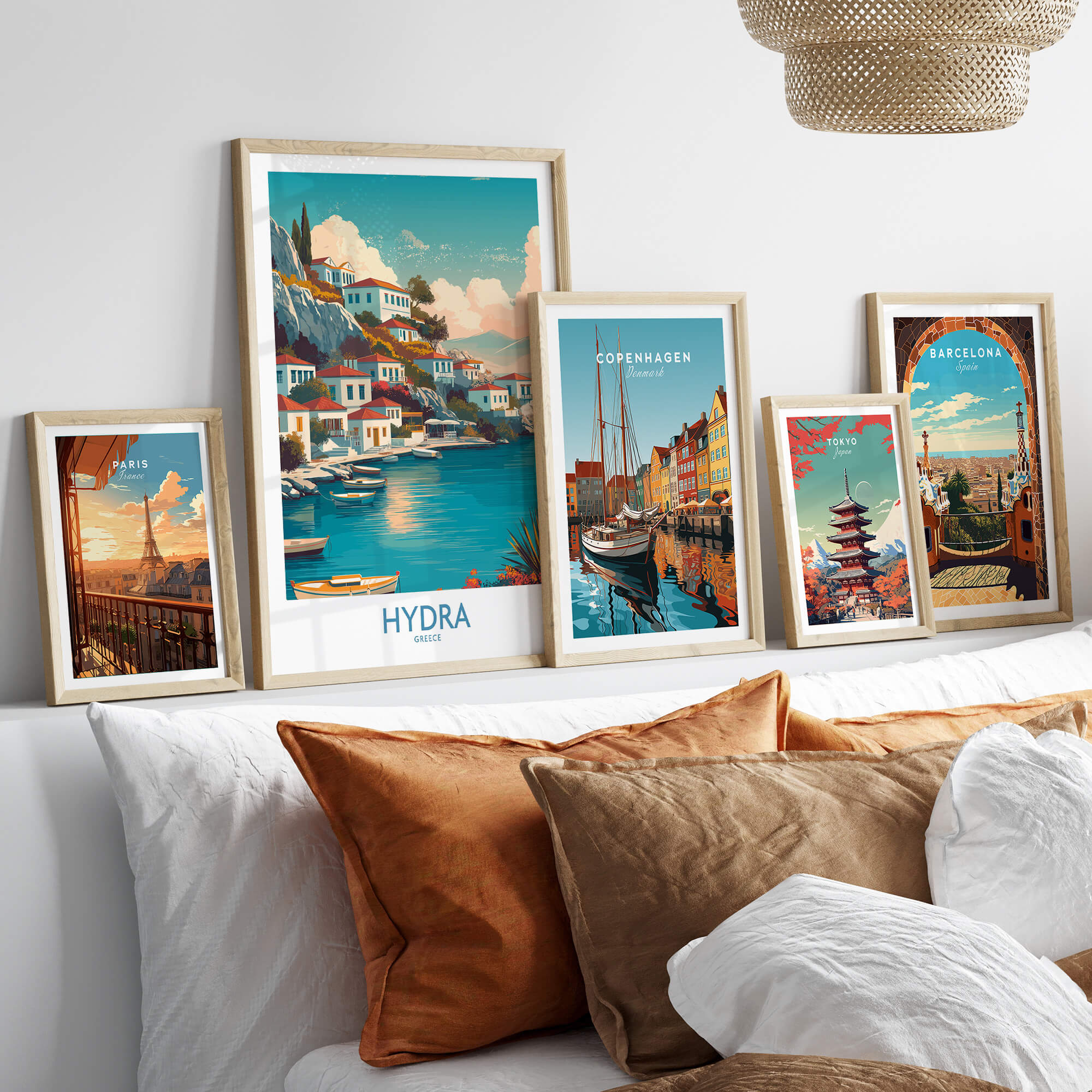 Hydra Greece Canvas Print | Blue Sea & White Architecture Poster displayed in stylish frames on a cozy sofa.