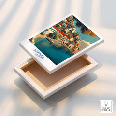 Hydra Greece Canvas Print | Mediterranean Seaside Town Poster displayed in an open box, showcasing picturesque waterfront view.