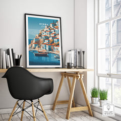 Hydra Greece Wall Art Print | Historic Port & Harbor Travel Poster displayed in a modern workspace with a black chair.