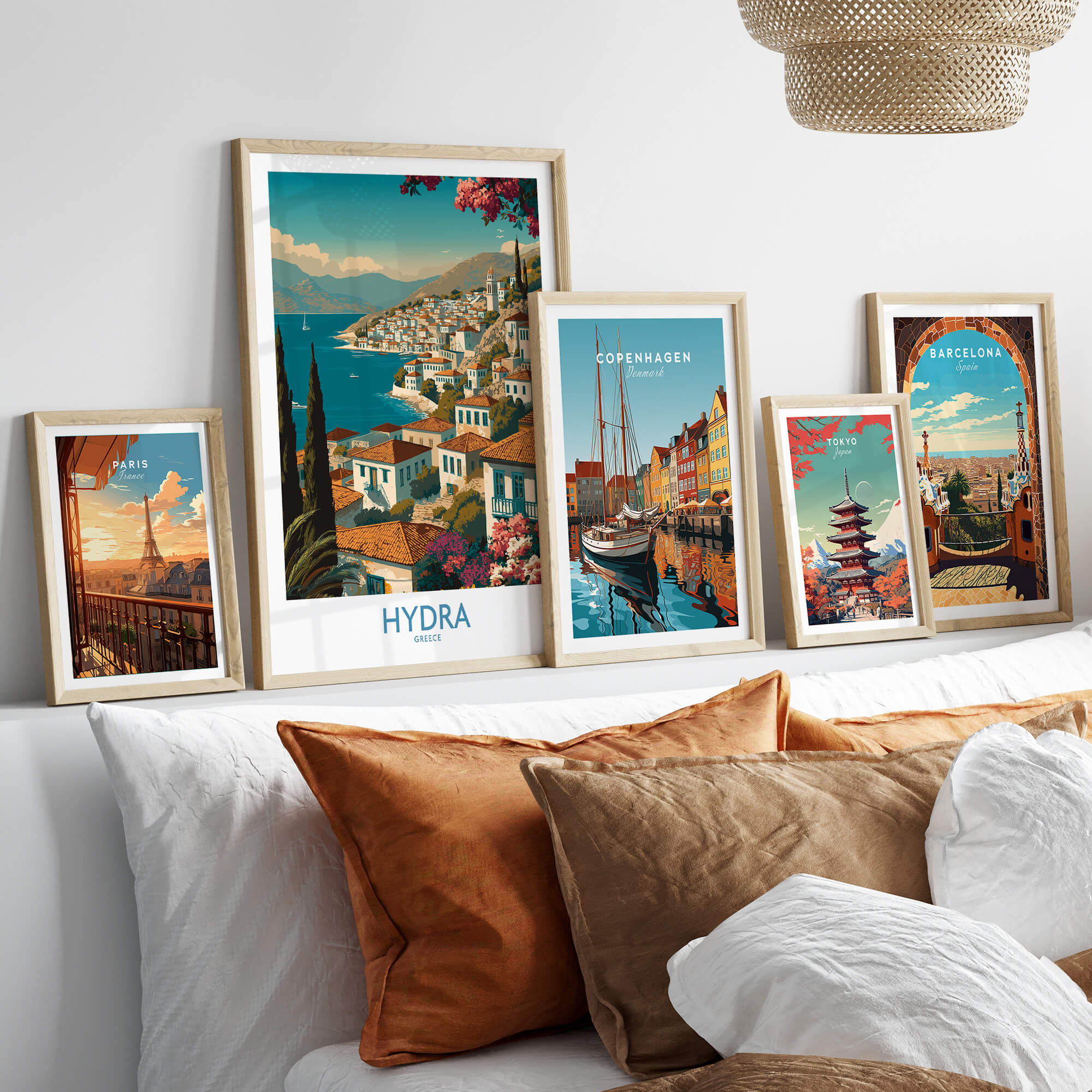 Hydra Greece Poster | Greek Island View Canvas Print displayed among framed art on a stylish sofa.
