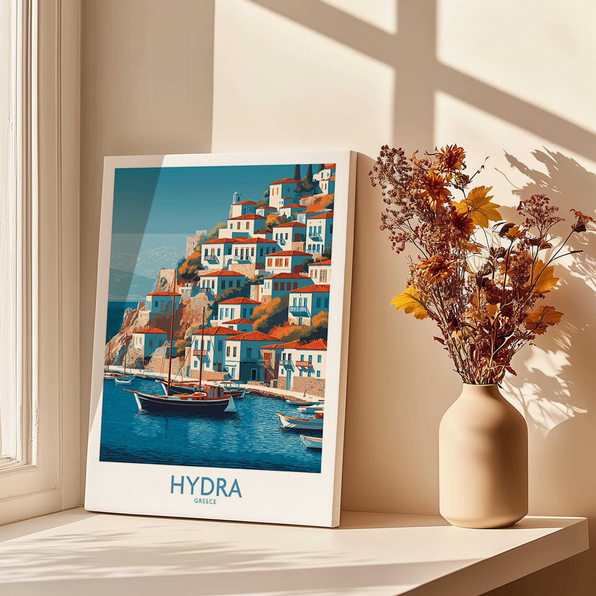 Hydra Greece Poster | Greek Island Village Scene Canvas Print displayed on a windowsill beside a vase of flowers.
