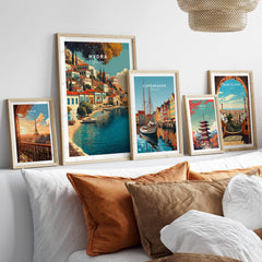 Hydra Greece Travel Poster | Harbor Side Promenade Wall Art Print displayed on a cozy couch with stylish decor.