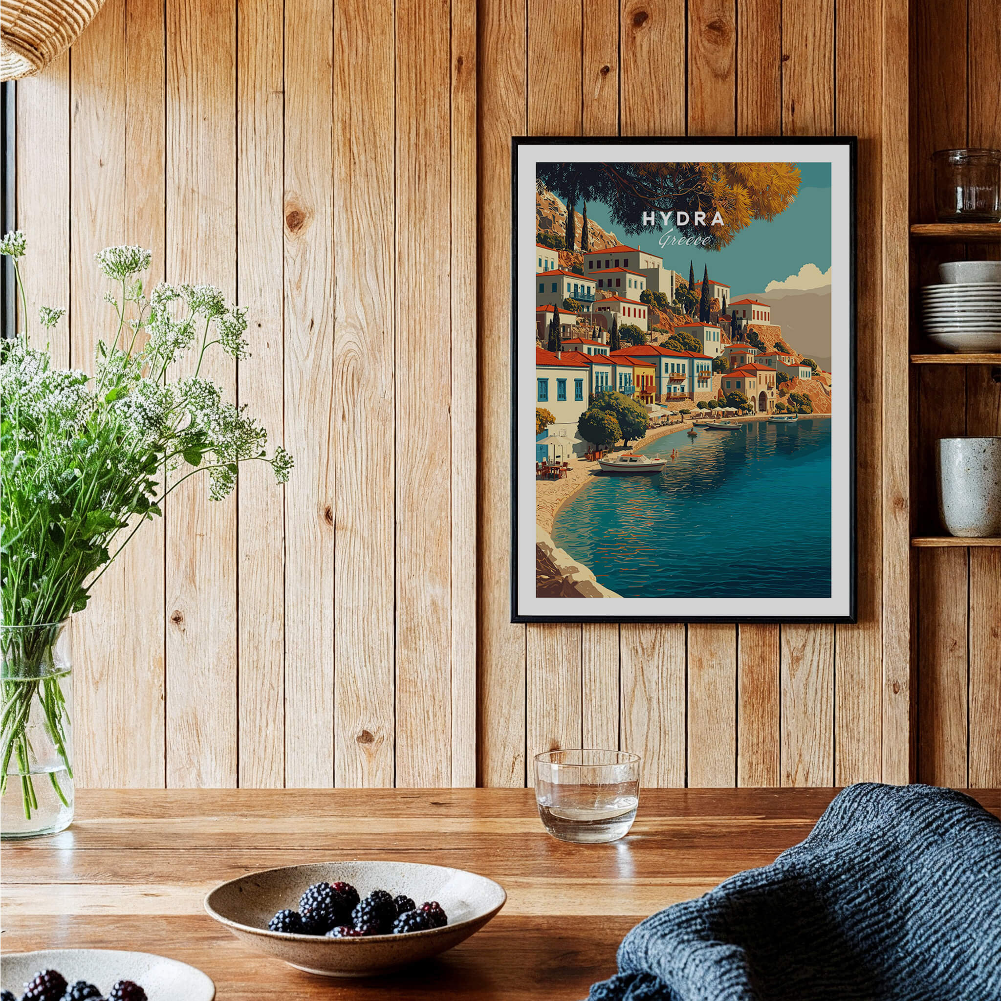 Hydra Greece Travel Poster | Harbor Side Promenade Wall Art Print displayed in rustic kitchen setting with plants.