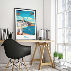 Ibiza Travel Poster spain displayed on wall above modern desk with chair and books, capturing vibrant beauty of Ibiza.